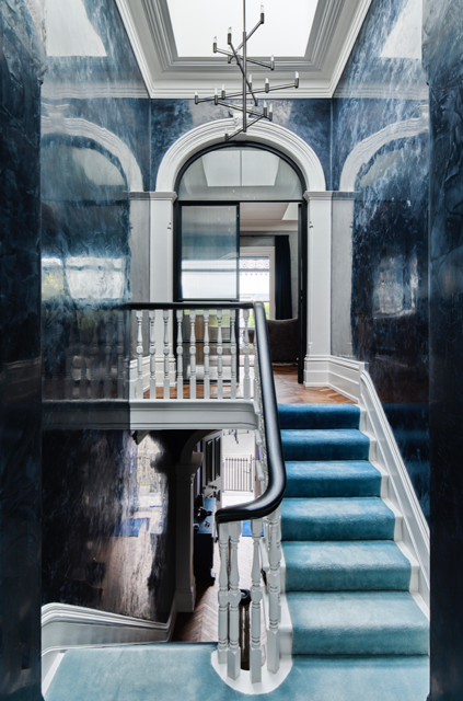 A sculptural staircase in a CasaCo home